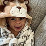 Bryson is registered to the contest to win money with this photo: toddler, child, smile, hood, robe, animal_costume, plush, cozy, indoor, couch, fabric, texture, happy, cute, baby, face, portrait, childhood, warm, comfort