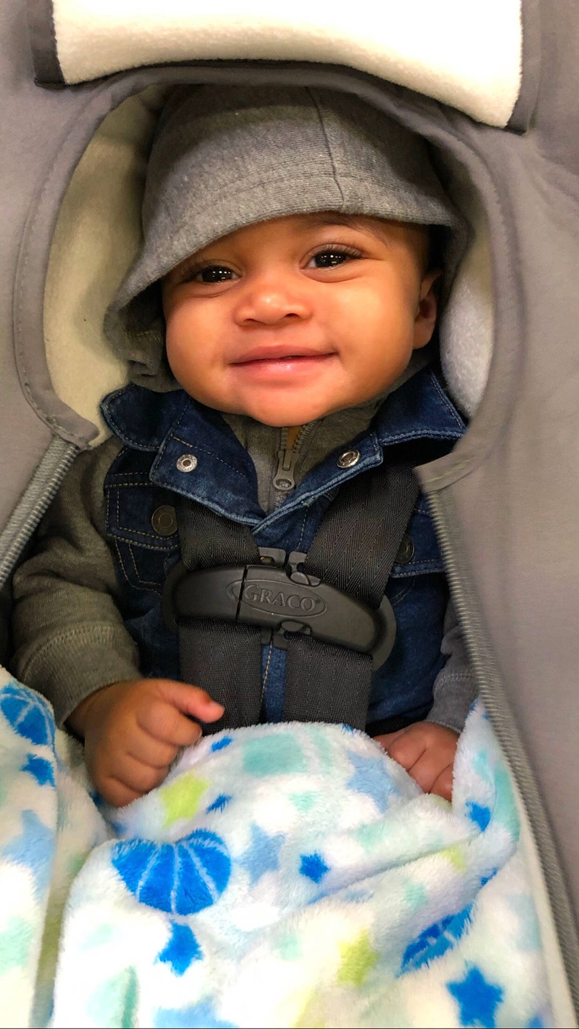 Juan is registered to the contest to win money with this photo: baby, baby_carriage, baby_in_car_seat, baby_products, cheek, child, eye, headwear, person, product, skin, smile, toddler