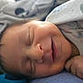 Persephone joined the competition — help win amazing prizes! baby, newborn, sleeping, smiling, closeup, face, hand, blanket, soft, cozy, infant, peaceful, cute, portrait, child, resting, clothing, skin, indoors, tender