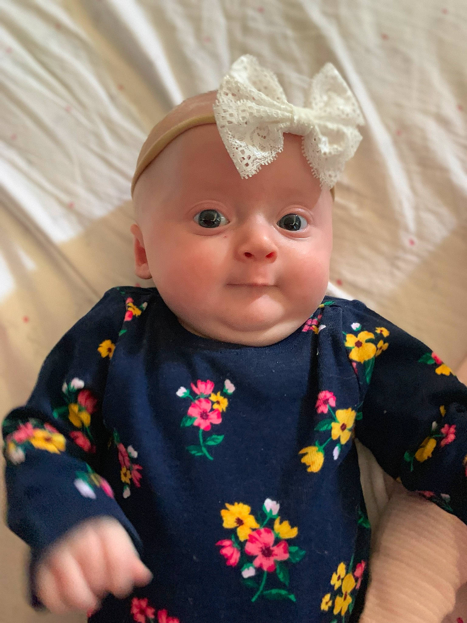 Adeline is registered to the contest to win money with this photo: baby, baby_products, baby_toddler_clothing, cheek, child, doll, dress, hair_accessory, head, headgear, iris, pattern, person, pink, skin, sleeve, toddler, toy