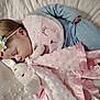 baby, sleeping, pajamas, headband, flower, plush_toy, blanket, cuddle, cute, infant, soft, comfort, peaceful, pink, blue, face, child, rest, bedtime, cozy