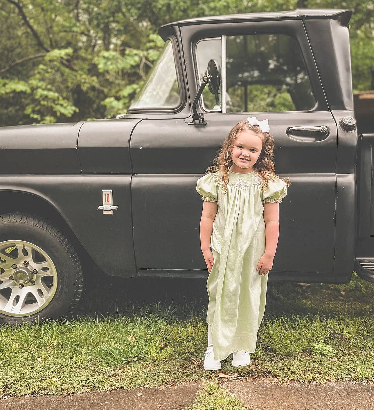Natilee joined the competition — help win amazing prizes! automotive_design, automotive_exterior, automotive_lighting, automotive_tire, bumper, car, classic, classic_car, fender, grass, hardtop, hood, joy, motor_vehicle, person, plant, tire, tree, truck, vehicle