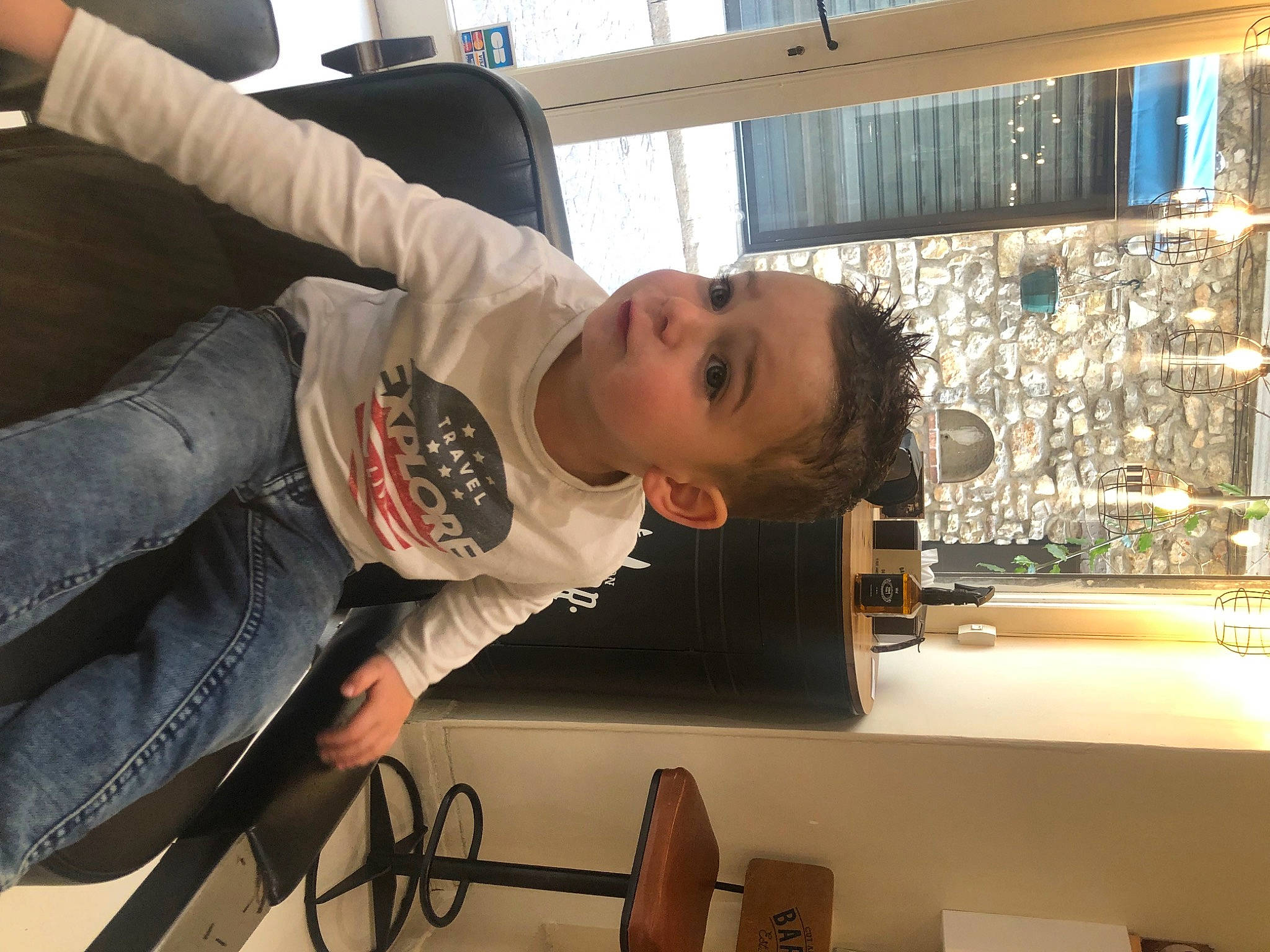 Wyatt participe au concours pour gagner de l'argent avec cette photo : baby, barware, child, clothing, comfort, fun, glass, glass_bottle, person, room, sitting, t_shirt, toddler