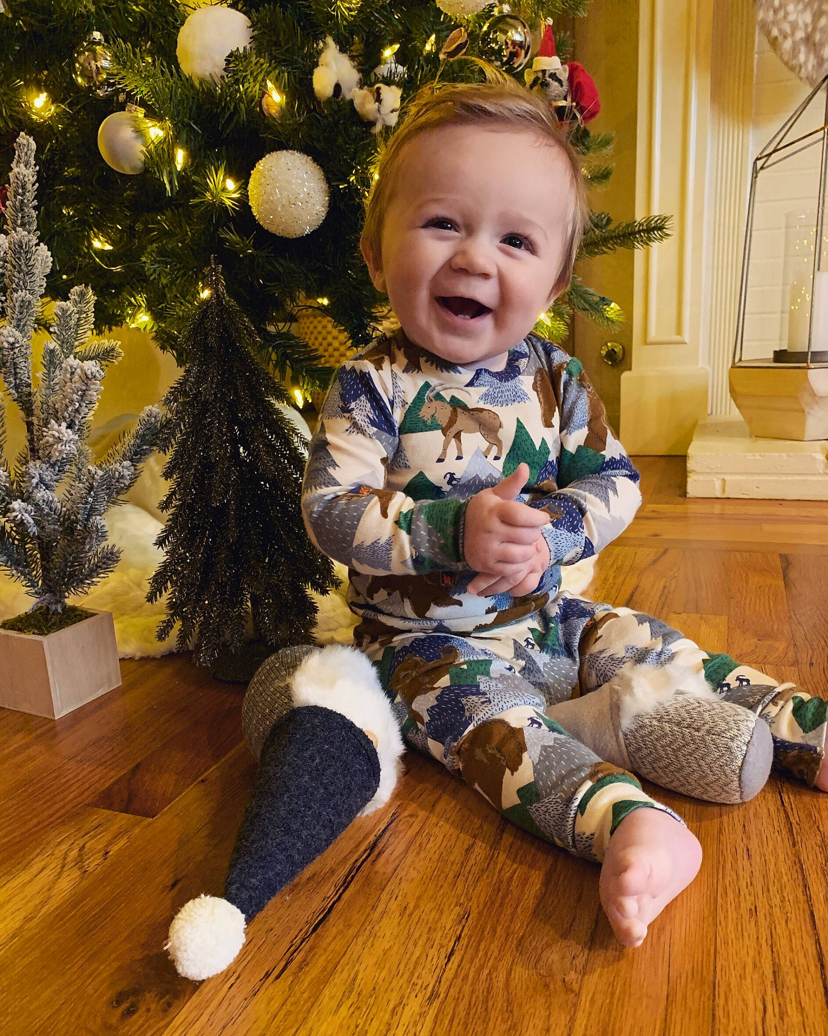 Jude joined the competition — help win amazing prizes! baby, baby_toddler_clothing, child, christmas, christmas_decoration, christmas_eve, christmas_ornament, christmas_tree, happy, holiday, interior_design, outerwear, person, plant, sitting, sleeve, smile, standing, toddler, tree