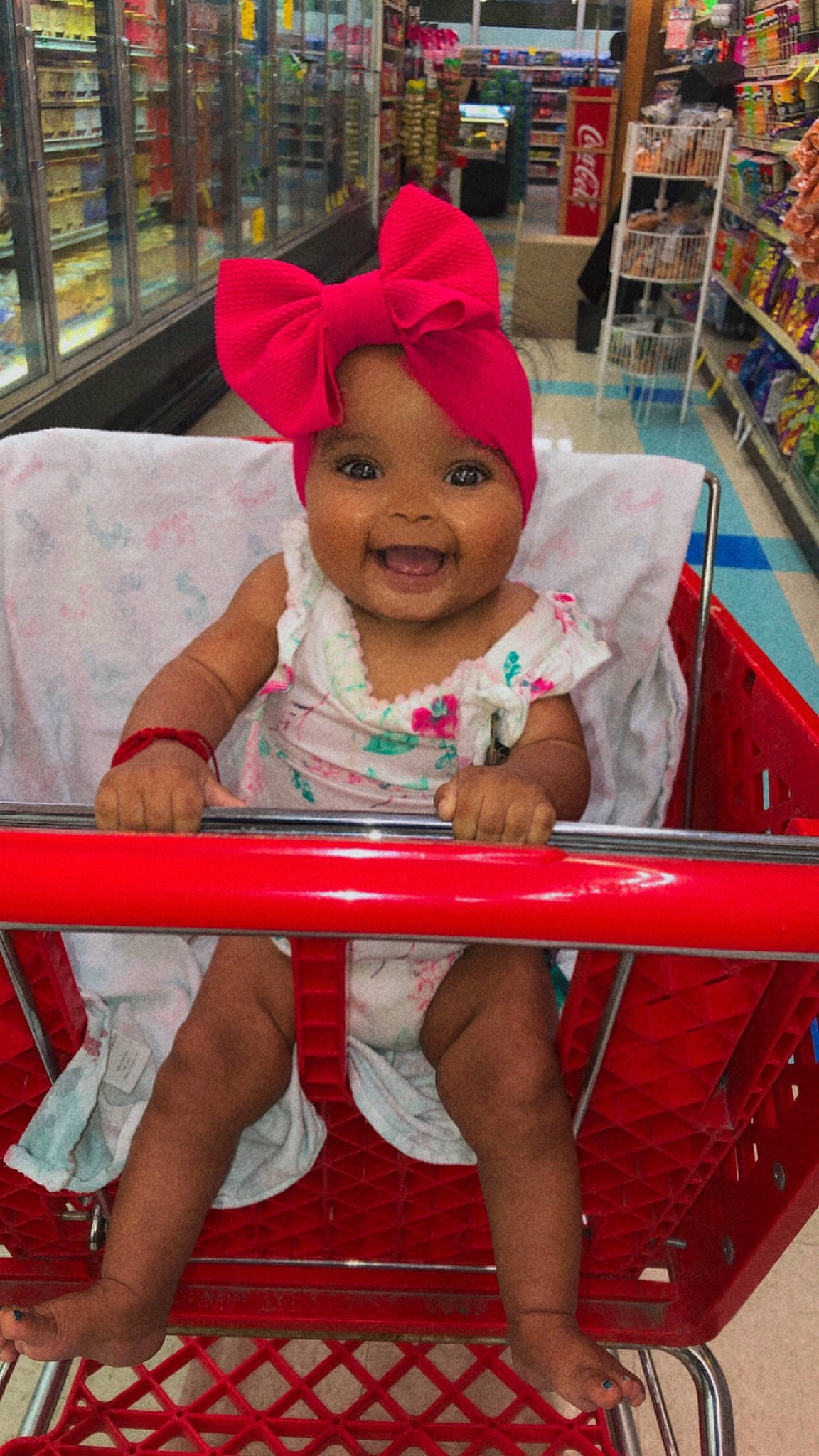 Mary joined the competition — help win amazing prizes! cap, cart, child, fun, happy, headwear, human_leg, joy, leisure, magenta, person, pink, recreation, red, shelf, shorts, skin, smile, thigh, tire