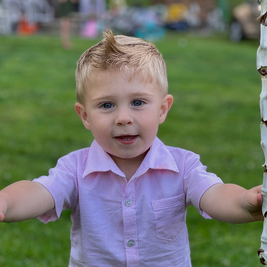 Bentley joined the competition — help win amazing prizes! arm, baby_toddler_clothing, cheek, eye, face, facial_expression, finger, gesture, grass, happy, head, human_body, iris, leisure, people_in_nature, person, plant, sleeve, standing, summer