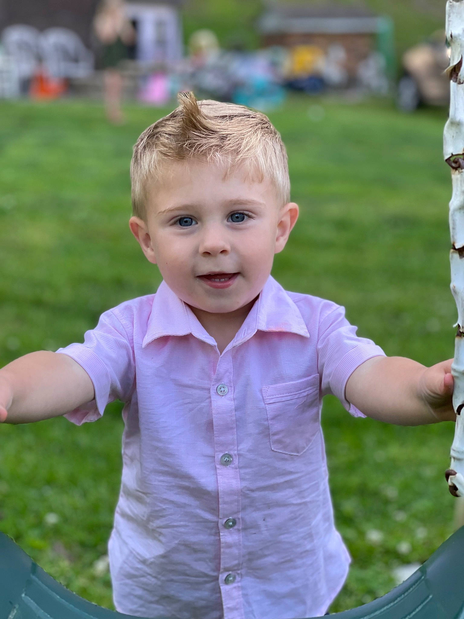 Bentley is registered to the contest to win money with this photo: baby_toddler_clothing, blond, child, electric_blue, fun, gesture, grass, happy, human_body, leisure, pattern, people, people_in_nature, person, pink, play, recreation, sitting, sleeve, smile