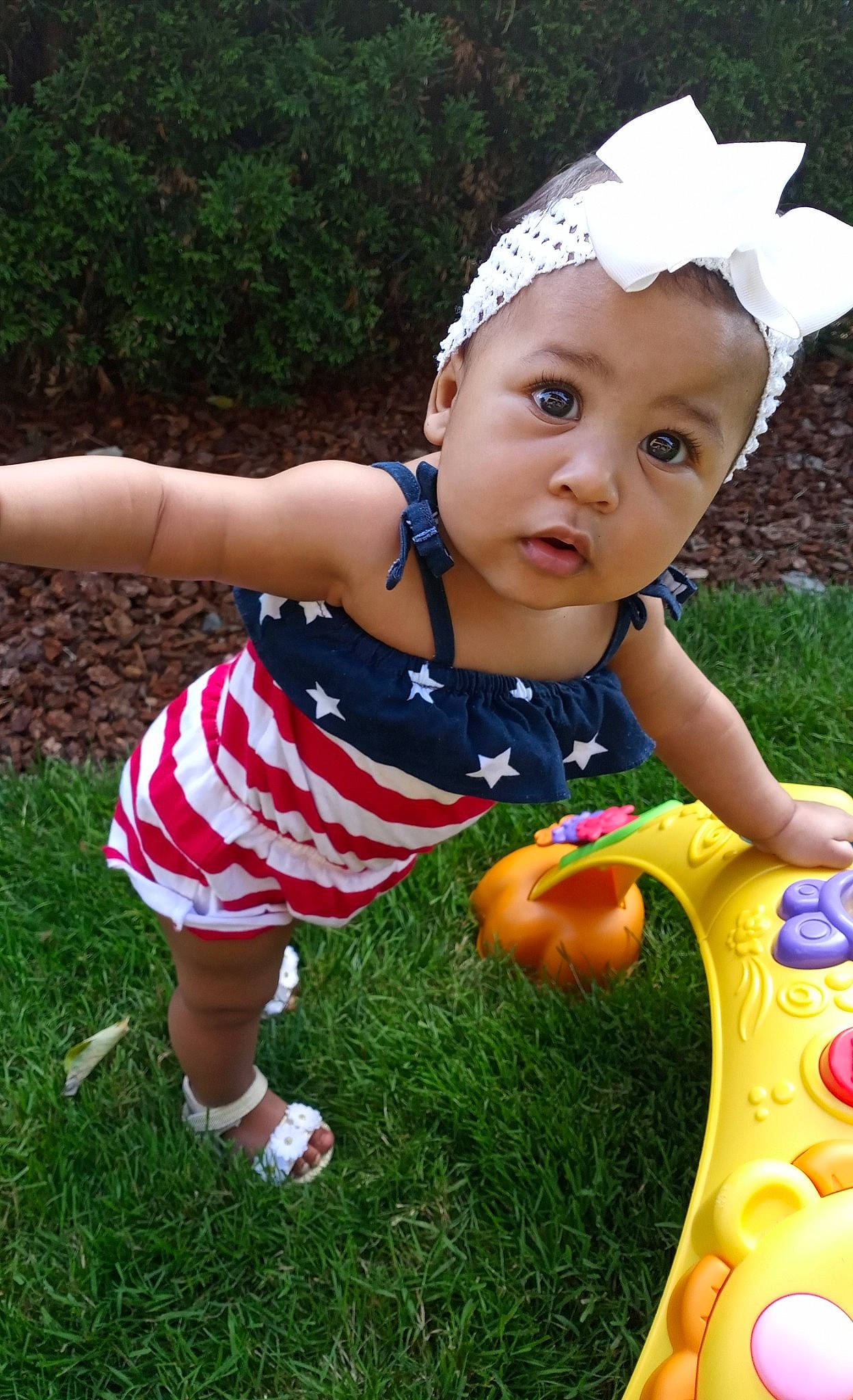 Lanna is registered to the contest to win money with this photo: baby, baby_toddler_clothing, child, fun, garden, grass, happy, lawn, person, plant, play, playground, smile, summer, toddler, vacation, yard, yellow