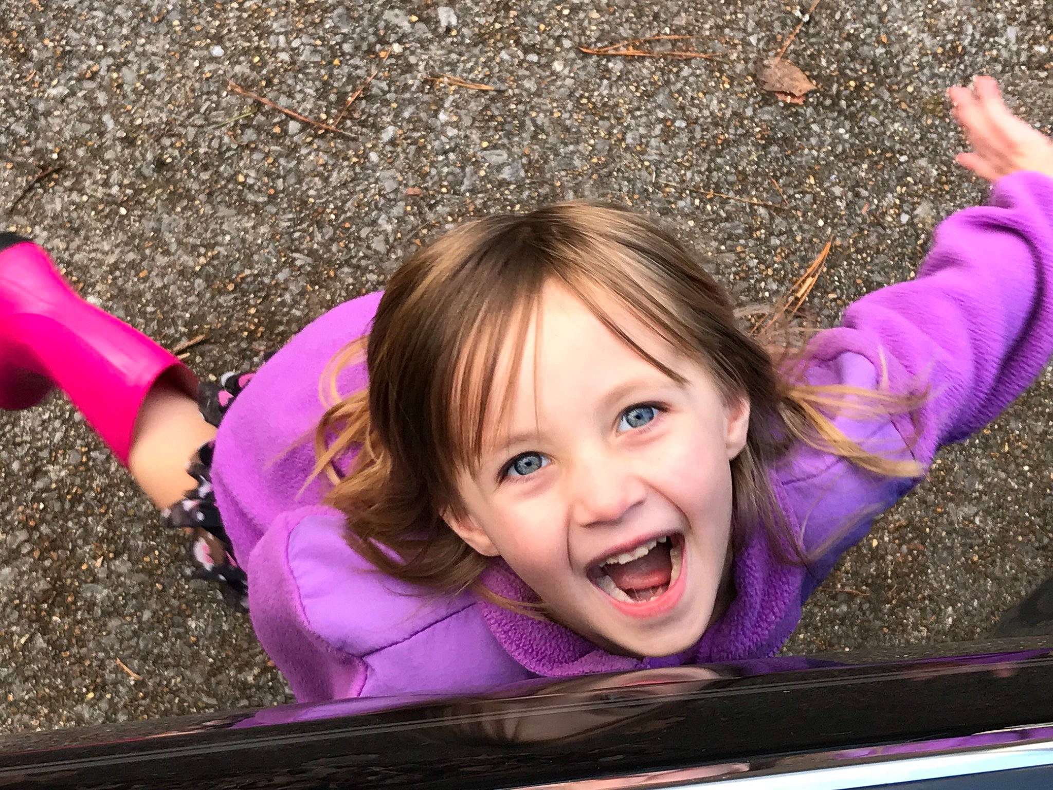 Andrea is registered to the contest to win money with this photo: child, emotion, eye, face, facial_expression, fun, girl, grass, happiness, head, joy, laughter, mouth, organ, person, pink, play, purple, skin, smile