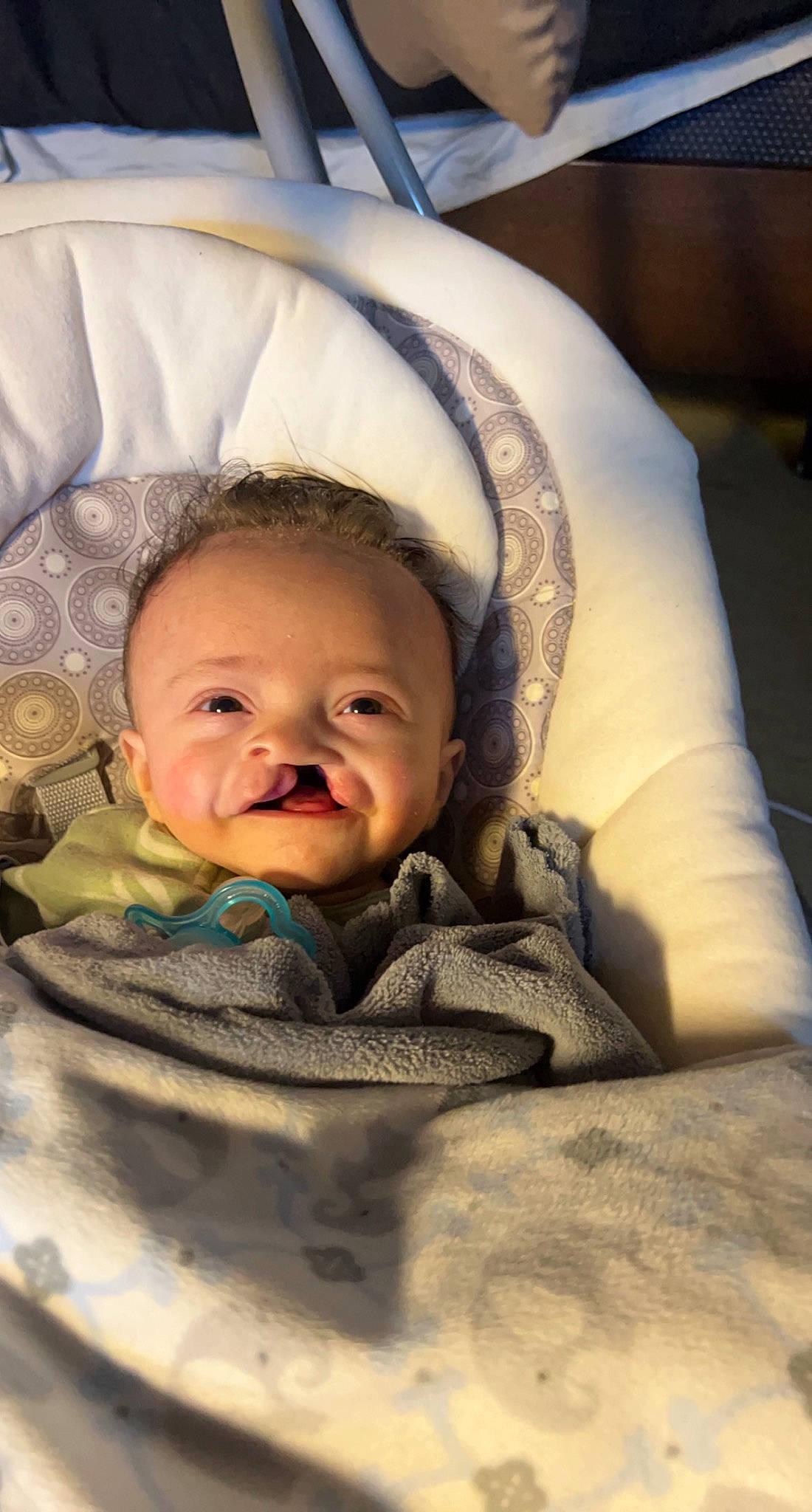 Ezrah joined the competition — help win amazing prizes! baby, baby_toddler_clothing, cheek, child, chin, comfort, eye, eyebrow, flash_photography, hairstyle, happy, head, iris, linens, mouth, nose, person, skin, sleeve, smile