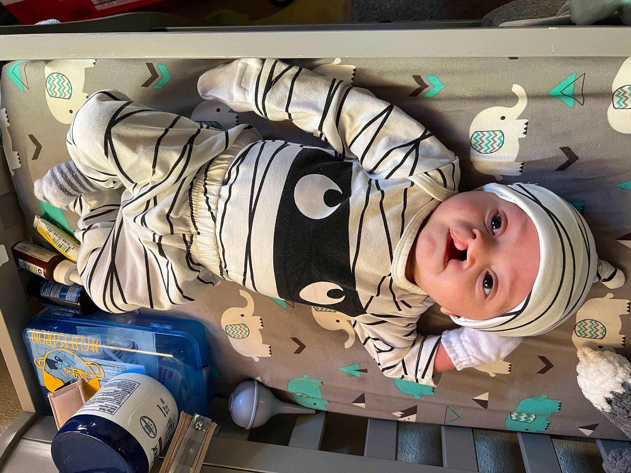 Ezrah joined the competition — help win amazing prizes! aluminum_can, art, baby, beverage_can, eyelash, font, graffiti, graphics, headwear, illustration, mural, paint, painting, paper, pattern, person, picture_frame, room, smile, street_art