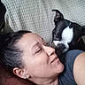 affection, blanket, boston_terrier, closeup, companion, couch, cuddle, dog, face, home, indoors, person, pet, pillow, portrait, relaxed, selfie, sitting, sofa, woman