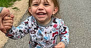 Pierson is registered to the contest to win money with this photo: blue_shoes, casual_clothing, child, cute, daytime, family, fun, grass, happy, holding_hands, joyful, nature, outdoor, person, playful, road, smiling, toddler, walking, young_child