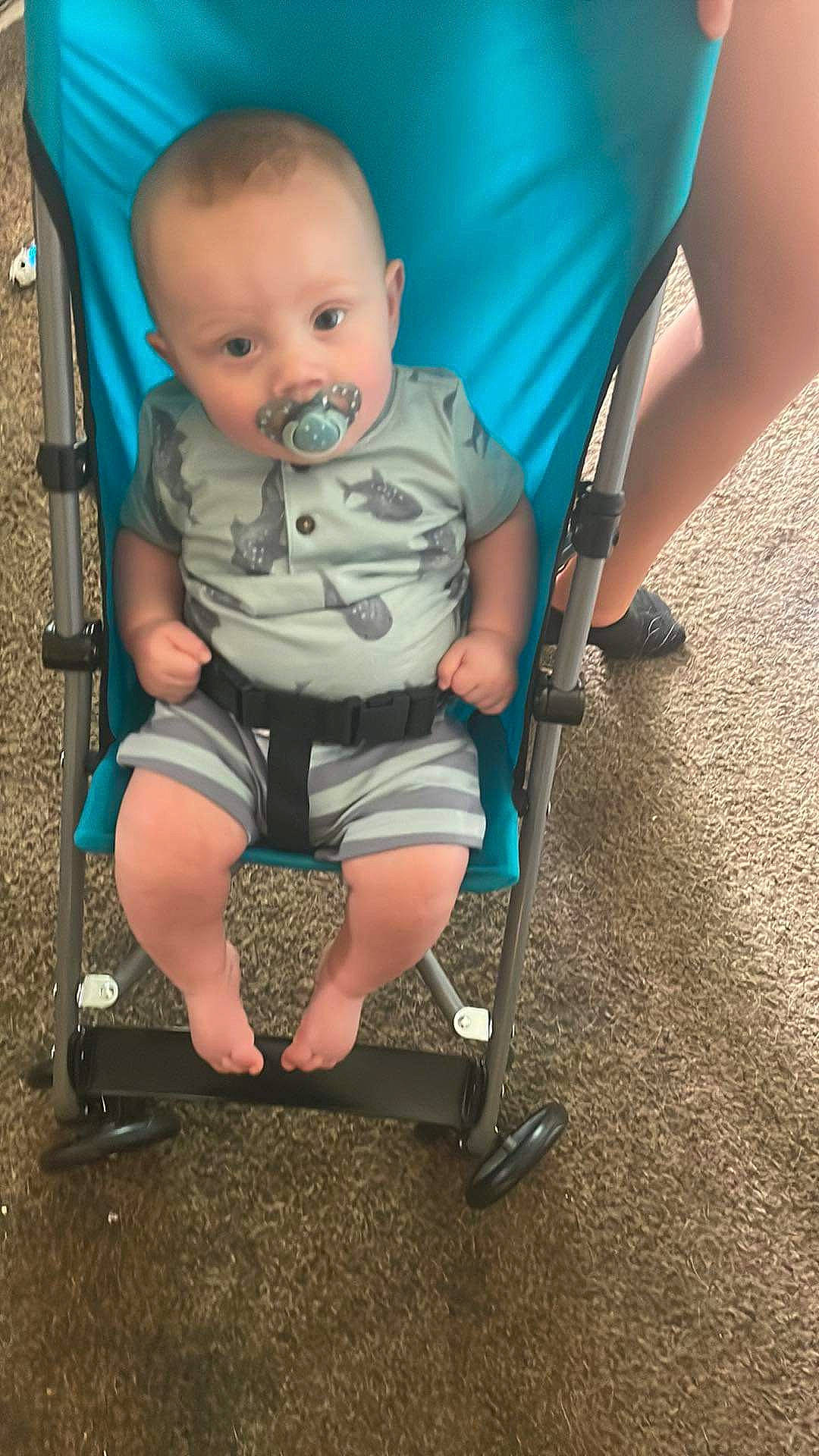 Jeffrey joined the competition — help win amazing prizes! baby, baby_carriage, baby_products, baby_toddler_clothing, blue, chair, child, comfort, electric_blue, eye, fun, head, human_leg, lap, leg, person, shorts, sitting, tire, toddler
