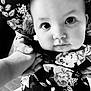 Willow joined the competition — help win amazing prizes! baby, child, face, eyes, hand, holding, floral_pattern, black_and_white, portrait, close_up, person, clothing, cute, expression, infant, human, tender, interaction, soft_light, indoors