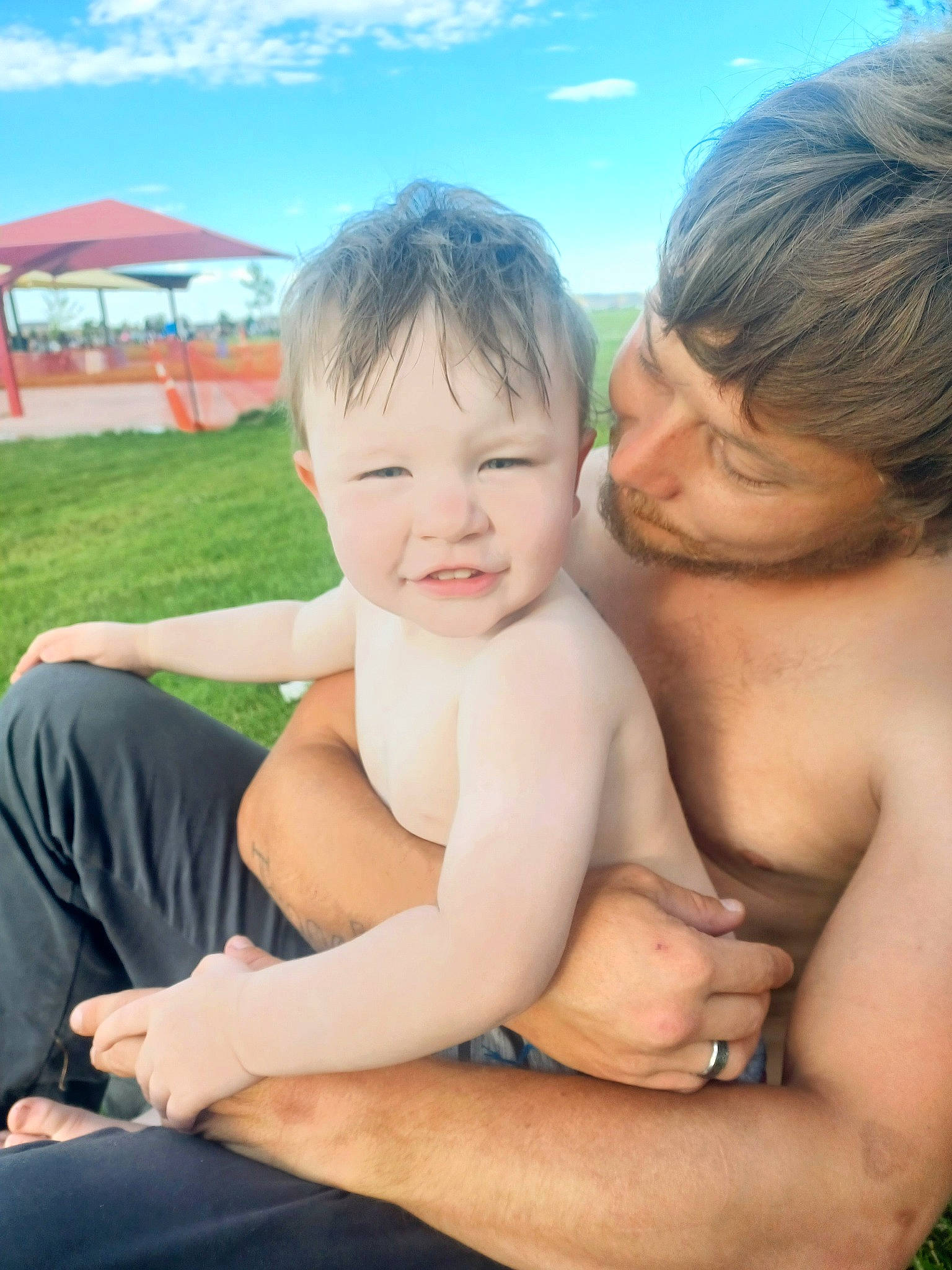 Ashton joined the competition — help win amazing prizes! arm, baby, chest, face, fun, gesture, grass, hand, happy, human, human_body, interaction, leisure, mammal, muscle, people_in_nature, person, skin, sky, smile