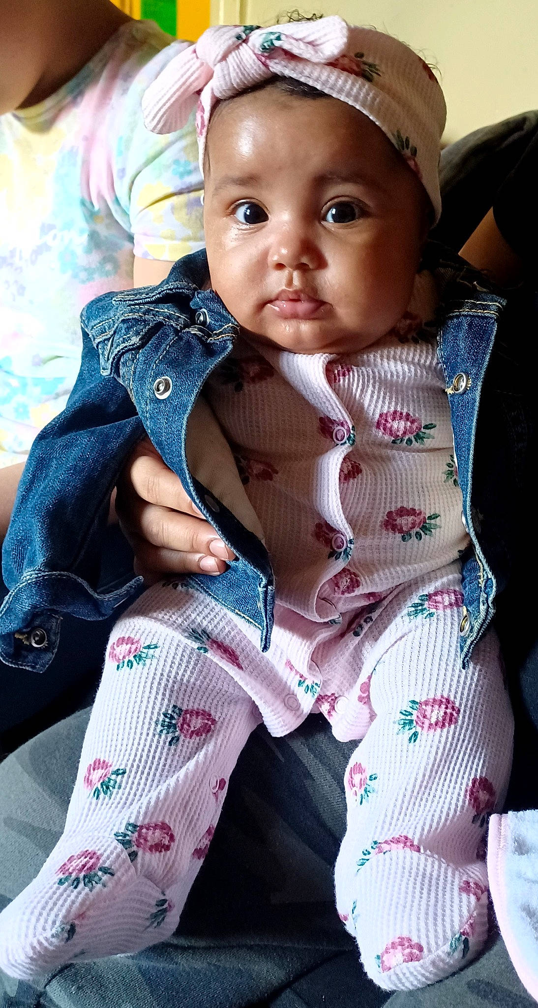 Treasure is registered to the contest to win money with this photo: arm, baby, baby_carriage, baby_toddler_clothing, cheek, dress, eye, face, facial_expression, hand, happy, headwear, human_body, iris, lip, pattern, person, pink, skin, sleeve