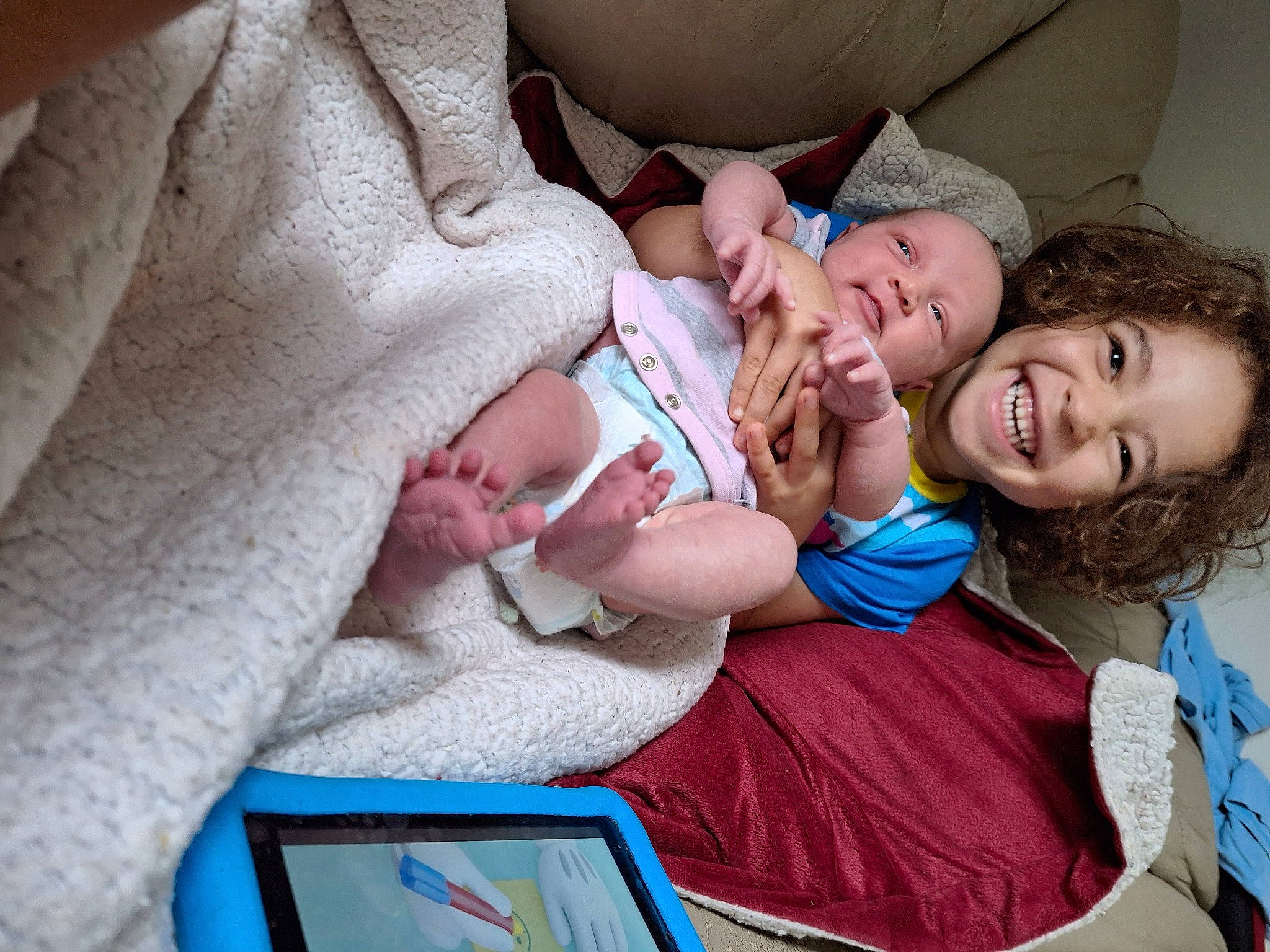 Ray joined the competition — help win amazing prizes! baby, child, comfort, event, fun, gesture, happy, hat, joy, laugh, nail, person, room, sitting, skin, smile, tablet_computer, toddler