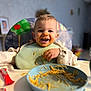 bib, child, clothing, eating, face, food, happy, high_chair, home, indoor, kitchen, messy, noodles, person, plate, smiling, spaghetti, table, toddler, utensils