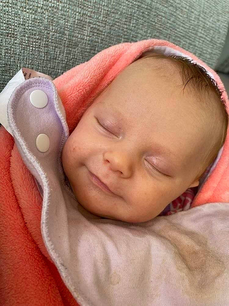 Bria joined the competition — help win amazing prizes! baby, baby_sleeping, baby_toddler_clothing, cheek, chin, comfort, eyebrow, facial_expression, finger, hand, human_body, lip, mouth, nose, organ, person, pink, skin, sleeve, textile
