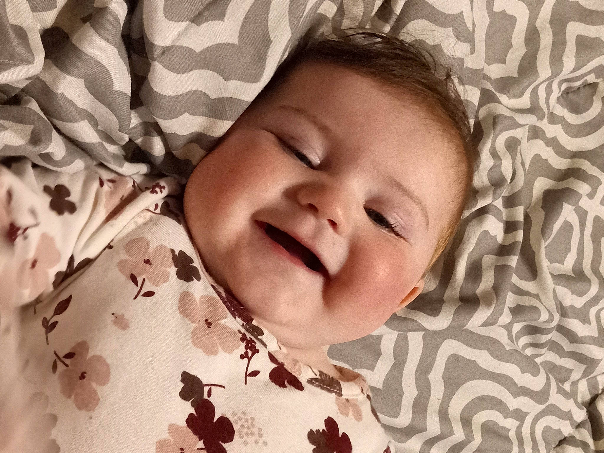 Zoie is registered to the contest to win money with this photo: baby, baby_toddler_clothing, beauty, cheek, child, close_up, comfort, face, facial_expression, happy, linens, pattern, person, photograph, pink, product, skin, smile, textile, toddler