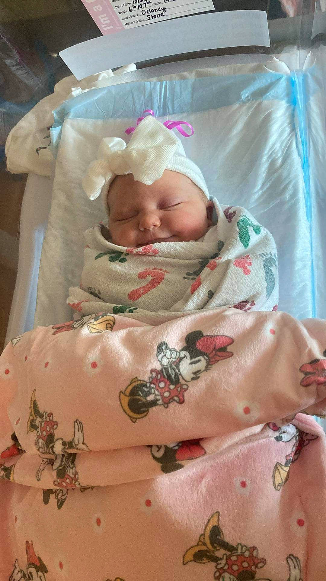 Madelyn joined the competition — help win amazing prizes! baby, baby_products, baby_safety, baby_sleeping, baby_toddler_clothing, child, comfort, event, hat, hospital, linens, pattern, peach, person, pink, room, skin, sleeve, smile, textile