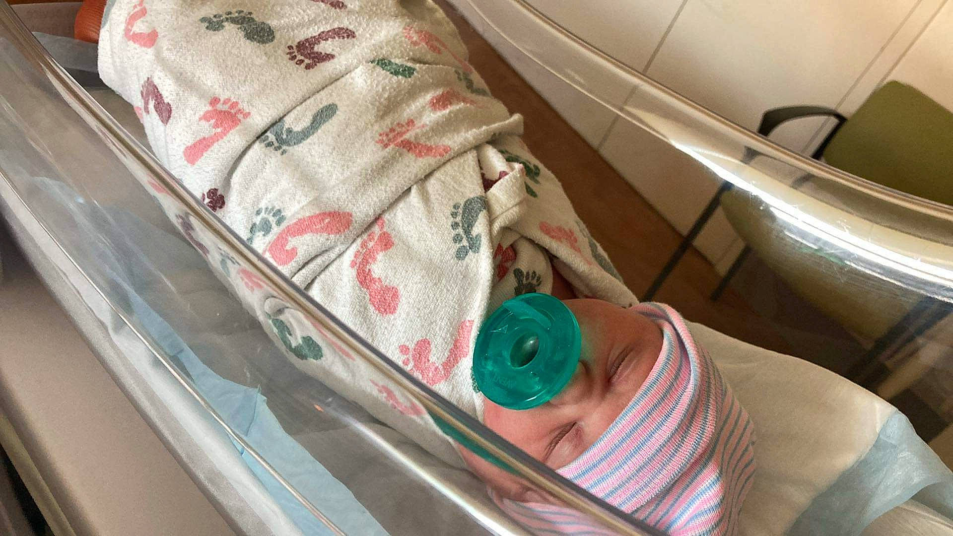 Madelyn is registered to the contest to win money with this photo: auto_part, automotive_design, automotive_exterior, bedding, comfort, laundry_room, linens, motor_vehicle, pattern, person, room, trunk, vehicle_door, windshield, wood