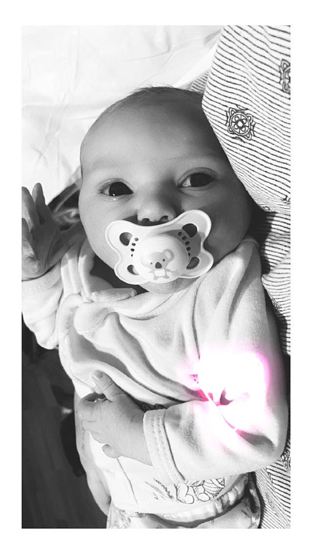 Madelyn is registered to the contest to win money with this photo: art, baby, baby_products, baby_toddler_clothing, cheek, child, comfort, flash_photography, fun, gesture, happy, human, laugh, linens, lip, monochrome, monochrome_photography, mouth, person, stock_photography