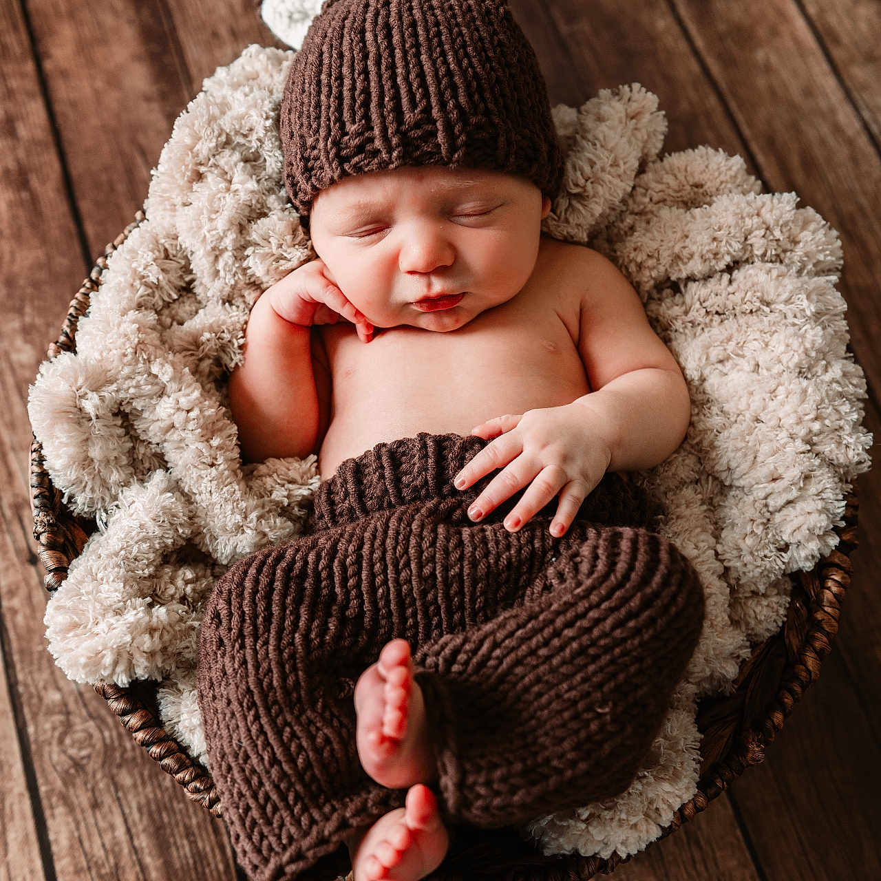 Parker is registered to the contest to win money with this photo: baby, beanie, blanket, bonnet, cap, clothing, doll, face, happy, hardwood, hat, head, newborn, person, photography, portrait, sleeping, smile, toy, wood