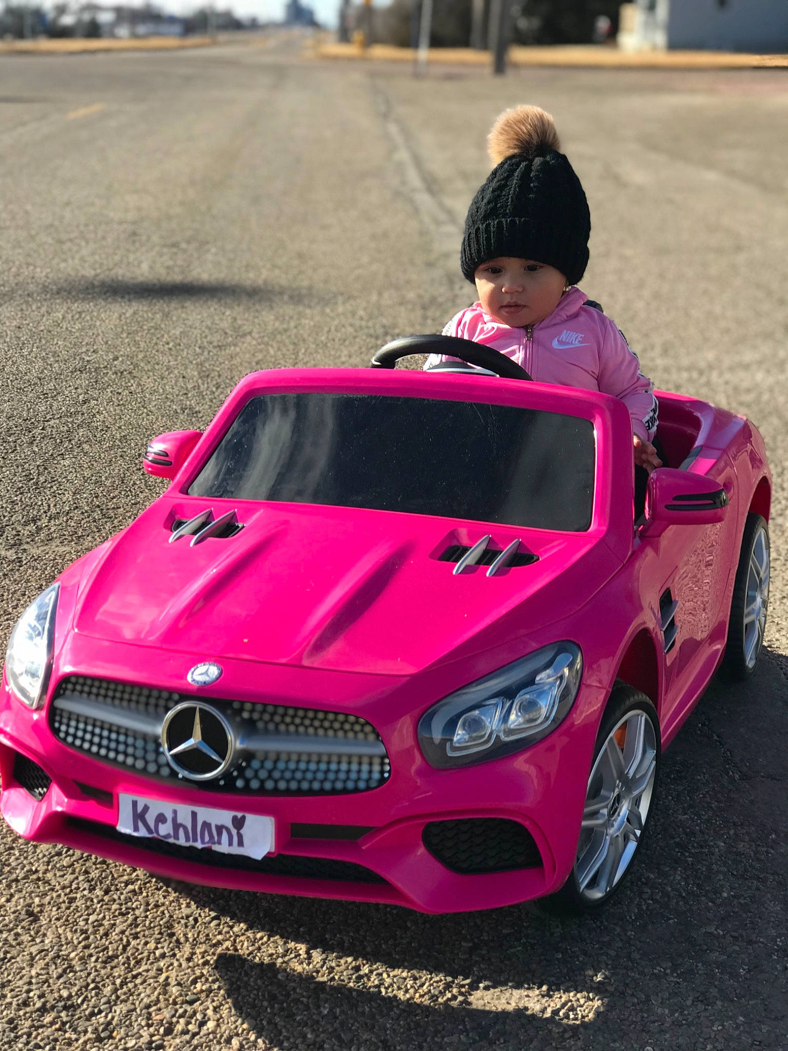 Kehlani joined the competition — help win amazing prizes! automotive_design, automotive_exterior, automotive_fog_light, automotive_lighting, automotive_tire, bumper, car, grille, headwear, hood, mode_of_transport, motor_vehicle, person, personal_luxury_car, photograph, pink, plant, red, sky, tire