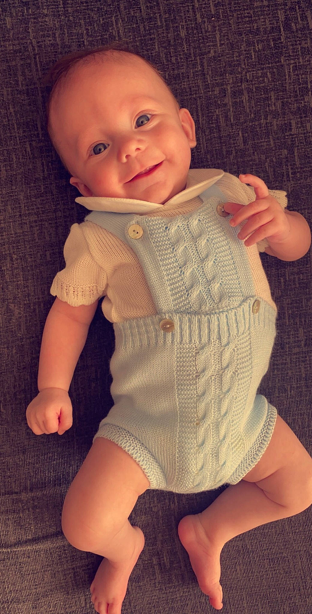 Cason is registered to the contest to win money with this photo: baby, baby_toddler_clothing, cheek, comfort, eye, face, finger, human_body, iris, leg, neck, outerwear, person, shoulder, skin, sleeve, smile, thigh, toddler, trunk