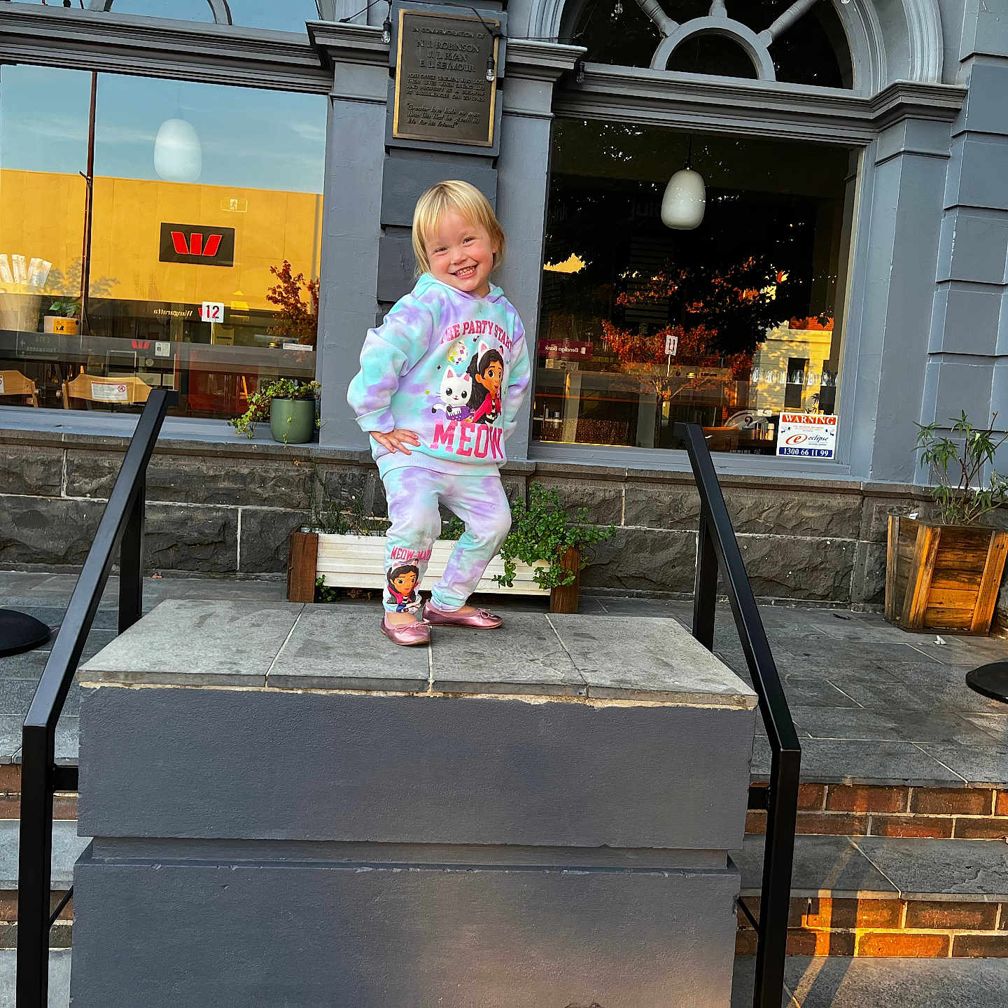 Harper-maree joined the competition — help win amazing prizes! architecture, building, child, clothing, face, female, girl, handrail, head, house, housing, pants, path, person, photography, plant, portrait, pottedplant, sitting, staircase