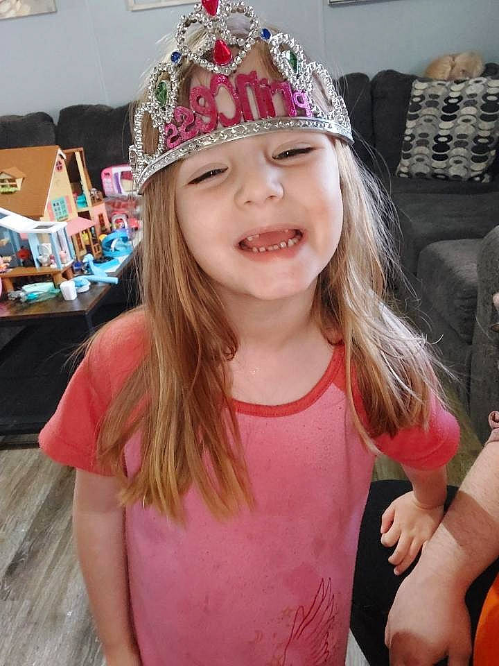 Katelyn is registered to the contest to win money with this photo: blond, cap, child, costume_hat, crown, event, fashion_accessory, fun, hair_accessory, happy, head, headband, headgear, headpiece, headwear, holiday, joy, magenta, party_supply, person