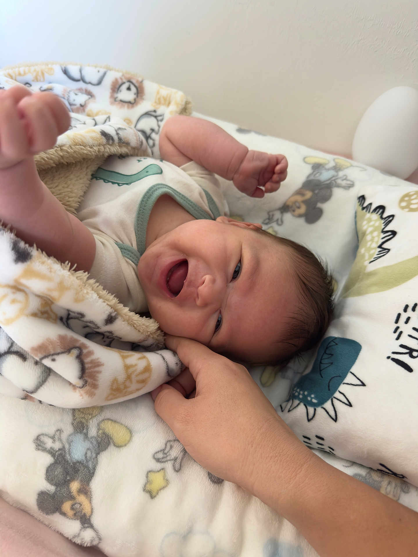 Jayden is registered to the contest to win money with this photo: baby, blanket, smiling, hand, infant, cute, cozy, bed, animal_print, child, happy, face, skin, person, soft, cuddle, playful, young, comfort, lying_down