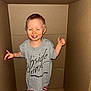Atticus joined the competition — help win amazing prizes! toddler, child, smiling, cardboard_box, grey_tshirt, striped_pants, blue_sock, standing, indoors, happy, cute, casual_clothing, play, fun, small_child, young_child, person, portrait, light_skin, short_hair