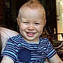 Atticus is registered to the contest to win money with this photo: toddler, child, smiling, indoor, striped_shirt, mohawk, happy, face, person, arm, hand, furniture, door, chair, home, light, room, casual, portrait, skin