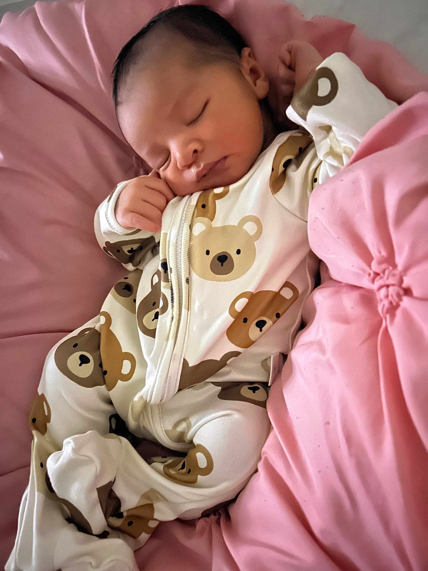Joriel joined the competition — help win amazing prizes! baby, sleeping, onesie, teddy_bear_pattern, pink_cushion, infant, soft, cozy, cute, child, resting, face, hand, clothing, bed, pillow, comfort, peaceful, newborn, portrait