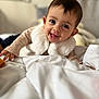 baby, smiling, face, infant, child, crawling, blanket, white, sweater, vest, indoors, cute, happy, portrait, young, cozy, warm, soft, person, head