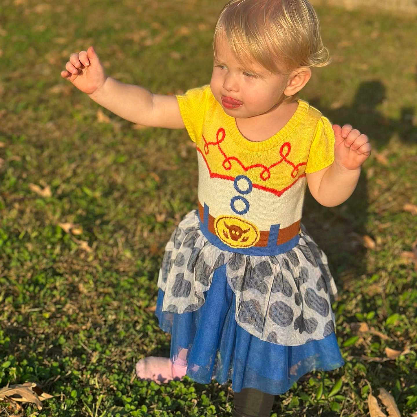 Shelby joined the competition — help win amazing prizes! backyard, bodypart, child, clothing, dress, face, female, finger, girl, grass, head, nature, outdoors, pants, person, photography, plant, portrait, skirt, yard