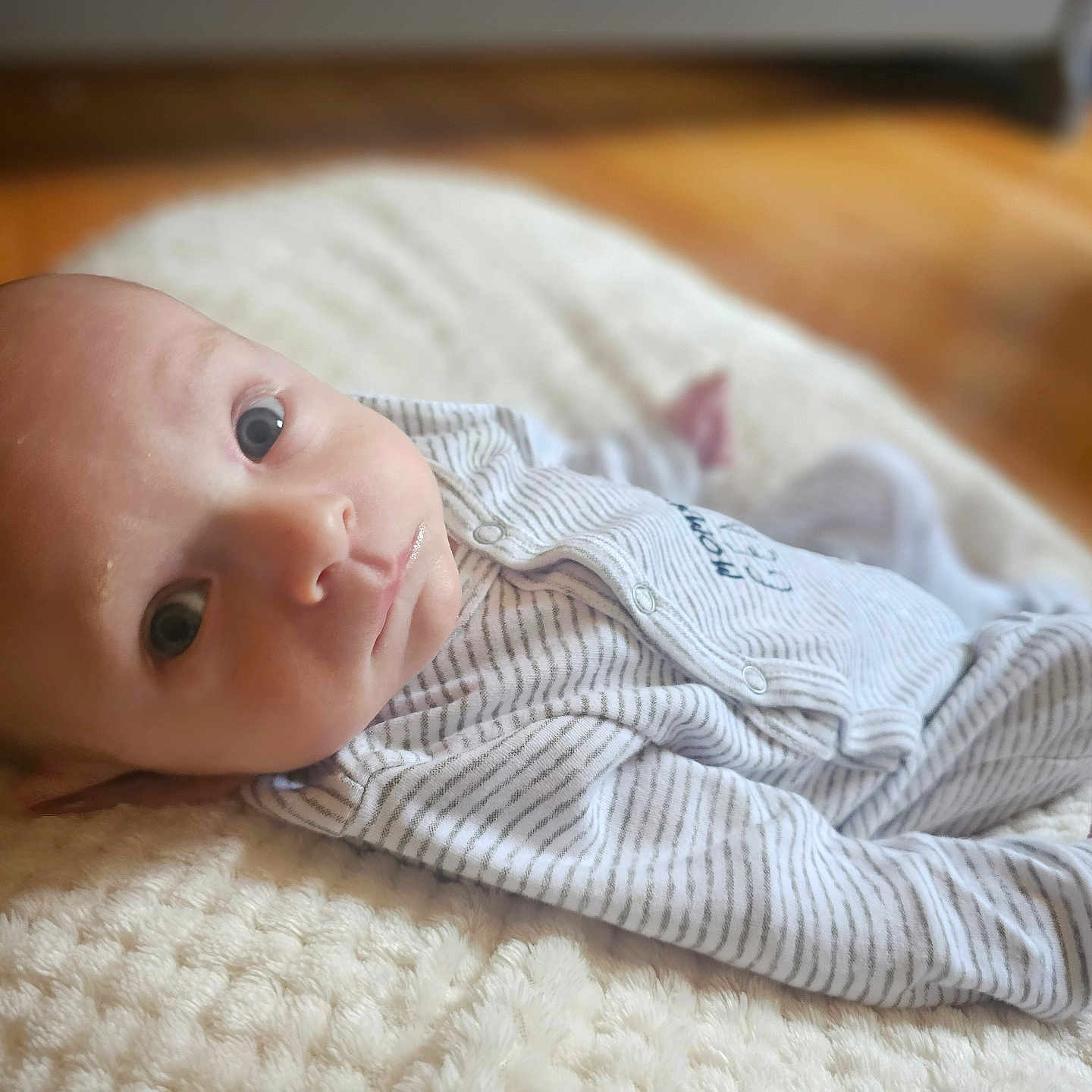 Redmond joined the competition — help win amazing prizes! baby, blanket, bodypart, clothing, face, finger, hand, happy, hardwood, head, knitwear, longsleeve, newborn, pants, person, photography, portrait, smile, sweater, wood