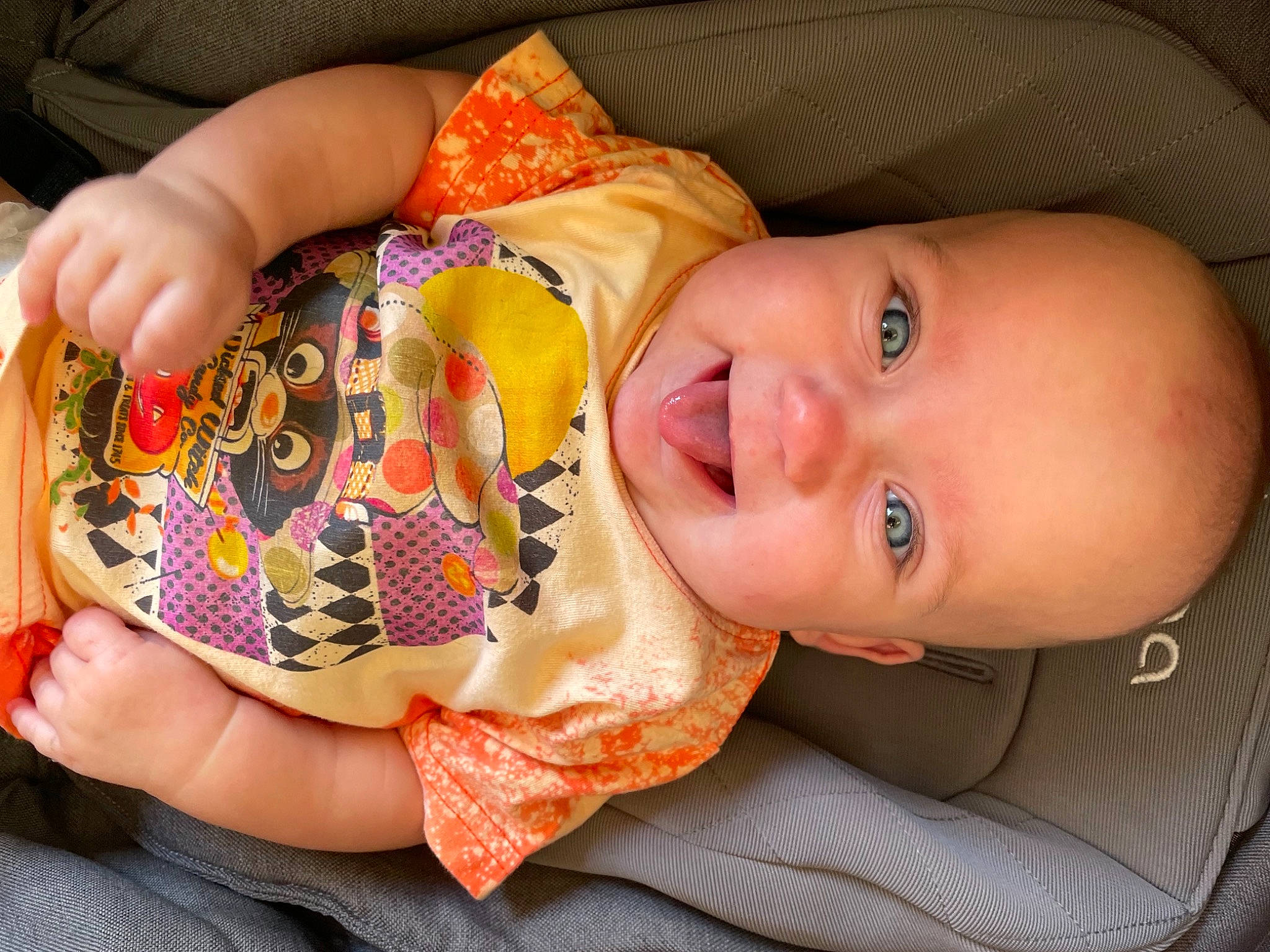 Evelyn joined the competition — help win amazing prizes! baby, baby_toddler_clothing, cheek, child, face, finger, fun, hand, happy, headgear, iris, lip, mouth, nail, nose, orange, pattern, person, skin, smile