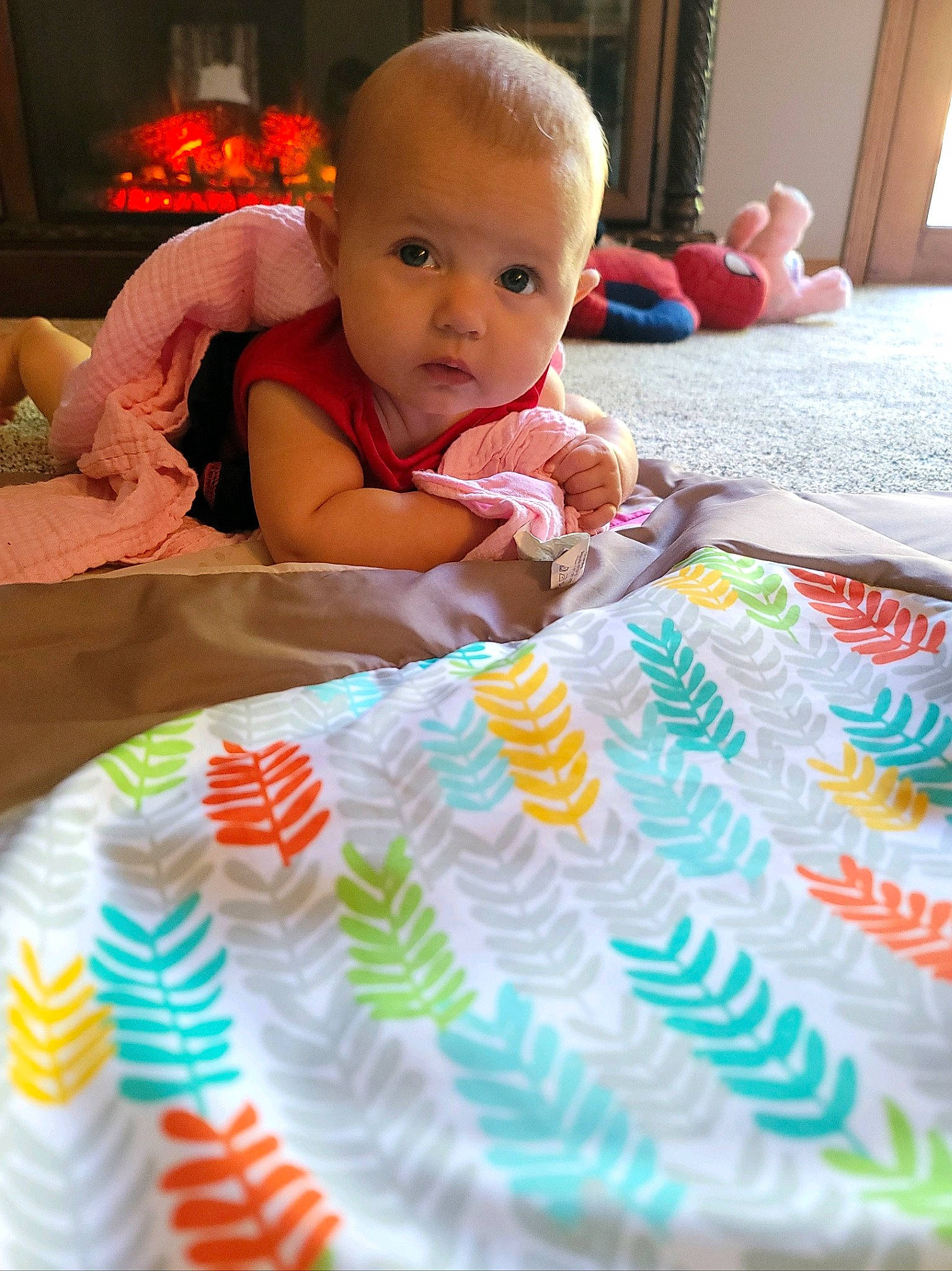 Addison is registered to the contest to win money with this photo: baby, baby_products, baby_toddler_clothing, bedding, cheek, child, comfort, face, flooring, fun, happy, head, iris, linens, pattern, person, pink, room, sitting, skin