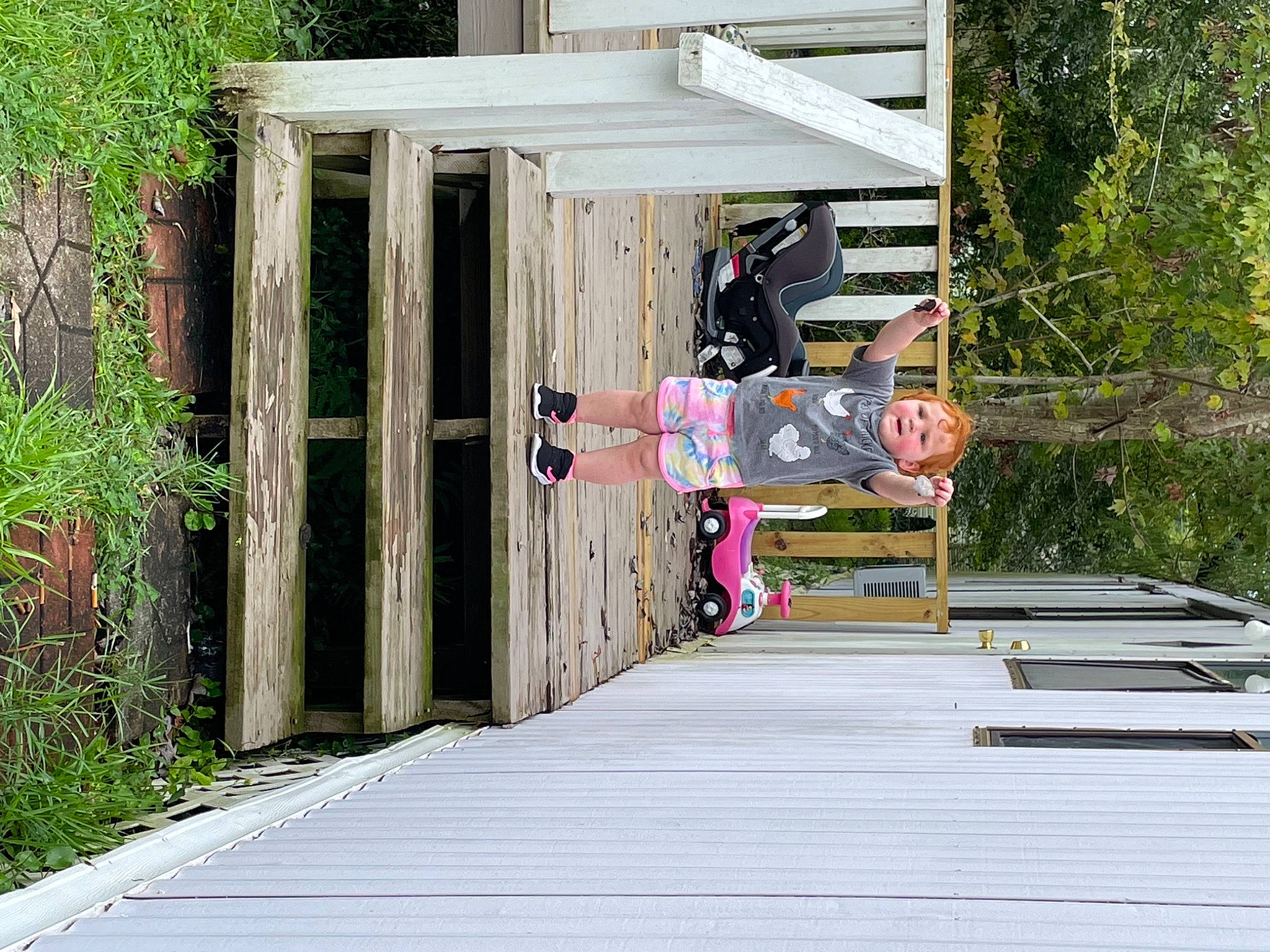 Julie is registered to the contest to win money with this photo: boardwalk, building, cottage, deck, garden_buildings, hardwood, house, landscape, leisure, lumber, outdoor_structure, person, plant, recreation, shed, siding, tree, walkway, wood, wood_stain