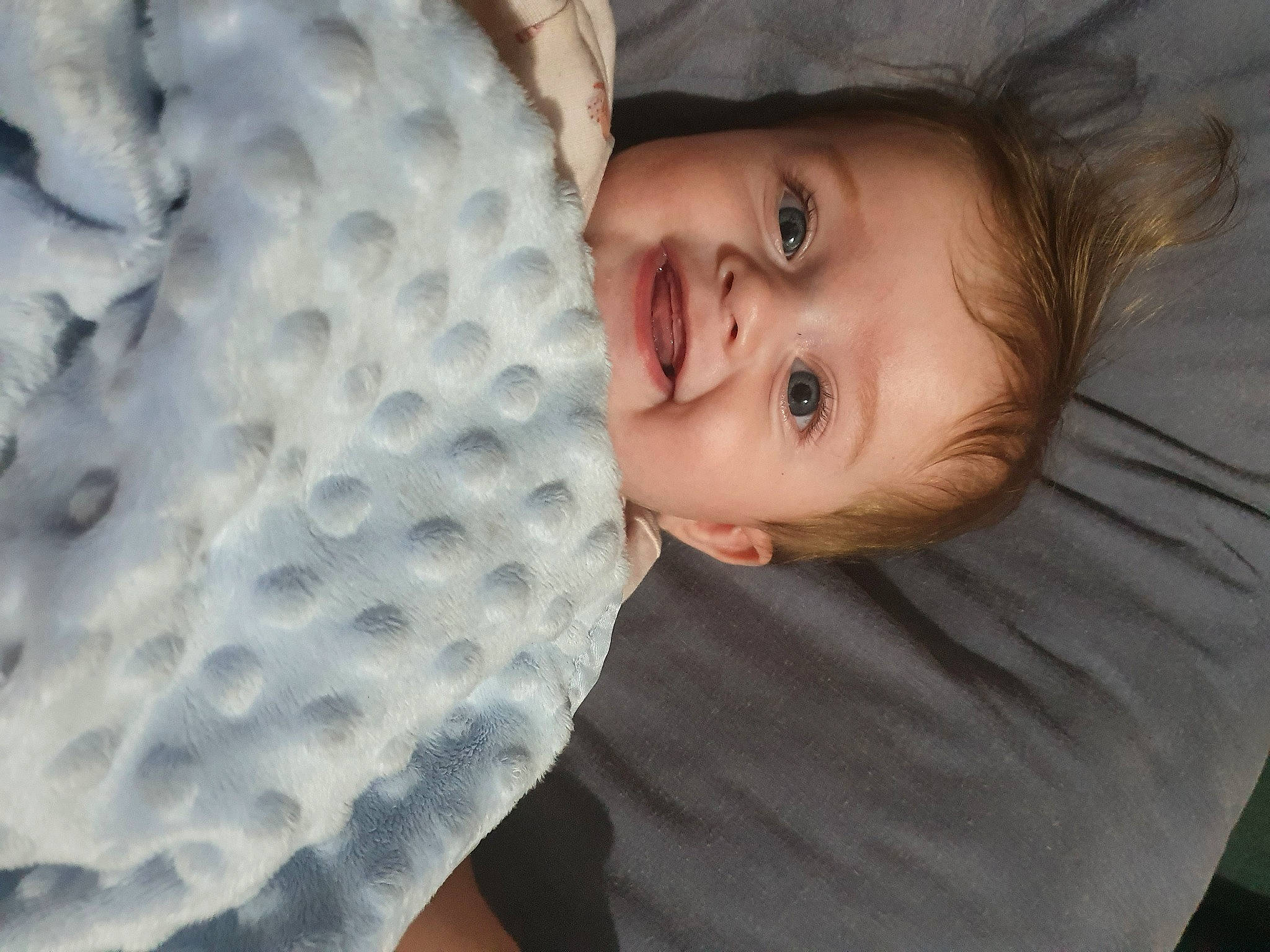 Lilly Rose is registered to the contest to win money with this photo: automotive_wheel_system, baby, baby_products, baby_toddler_clothing, cheek, child, comfort, electric_blue, flash_photography, fun, hairstyle, happy, linens, mouth, nose, pattern, person, portrait_photography, smile, textile