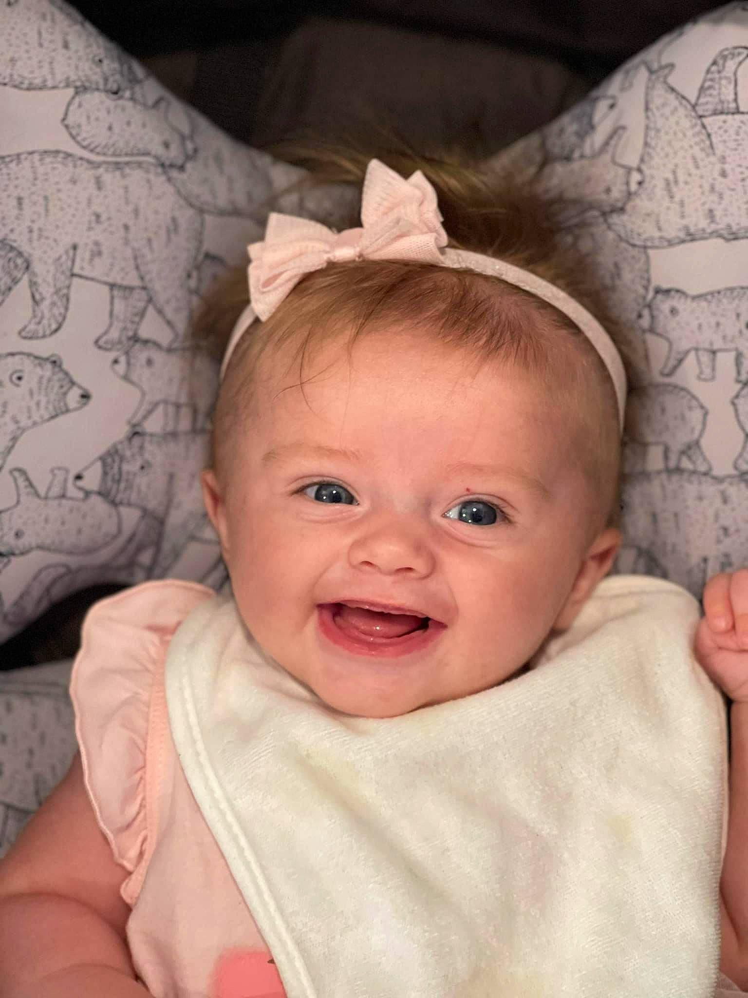 Lilly Rose is registered to the contest to win money with this photo: baby, baby_toddler_clothing, cheek, child, comfort, ear, eye, eyebrow, eyelash, happy, head, iris, lip, neck, person, pink, skin, sleeve, smile, textile