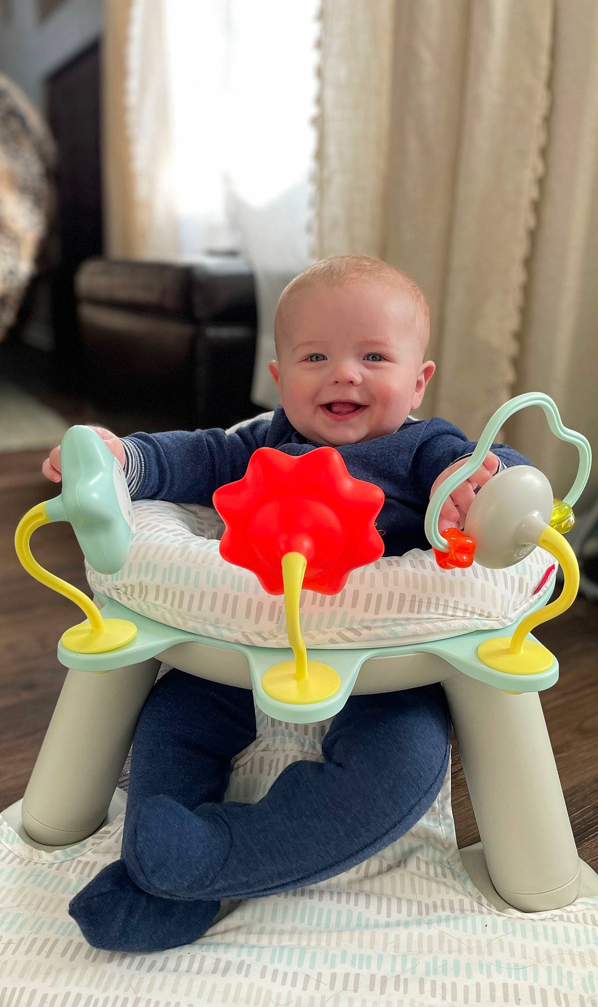 Maxwell joined the competition — help win amazing prizes! baby, baby_playing_with_toys, baby_products, baby_toddler_clothing, baby_toys, chair, child, comfort, curtain, fun, happy, joy, person, plastic, riding_toy, room, sitting, smile, toddler, toy