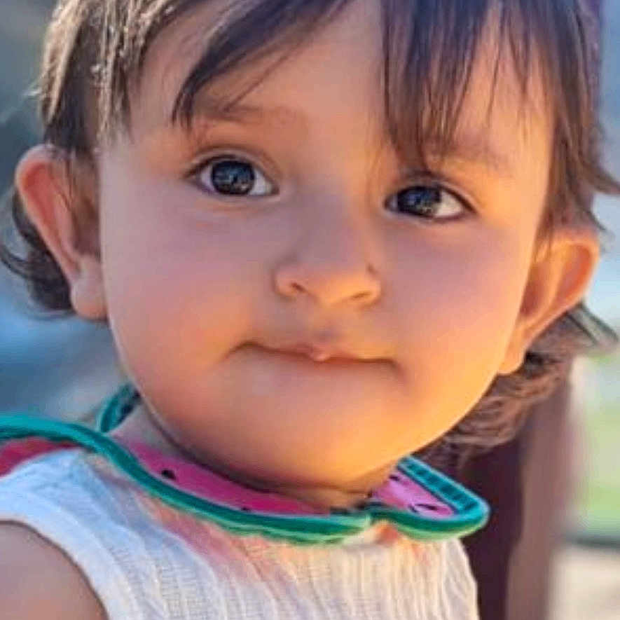 Elaya joined the competition — help win amazing prizes! child, toddler, face, portrait, outdoor, white_dress, sunglasses, curly_hair, young_child, cute, person, sunlight, daylight, skin, expression, eyes, head, clothing, background, innocent