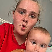 Lorenzo joined the competition — help win amazing prizes! baby, brown_clothing, child, closeup, cute, eyes, face, family, freckles, head, home, indoor, infant, portrait, puckered_lips, red_shirt, selfie, smiling, wide_eyed, woman