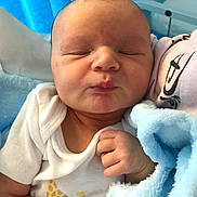 Lorenzo joined the competition — help win amazing prizes! baby, blanket, blue, child, closeup, cute, face, giraffe_print, hand, head, indoors, infant, newborn, onesie, peaceful, portrait, resting, skin, sleeping, soft_texture