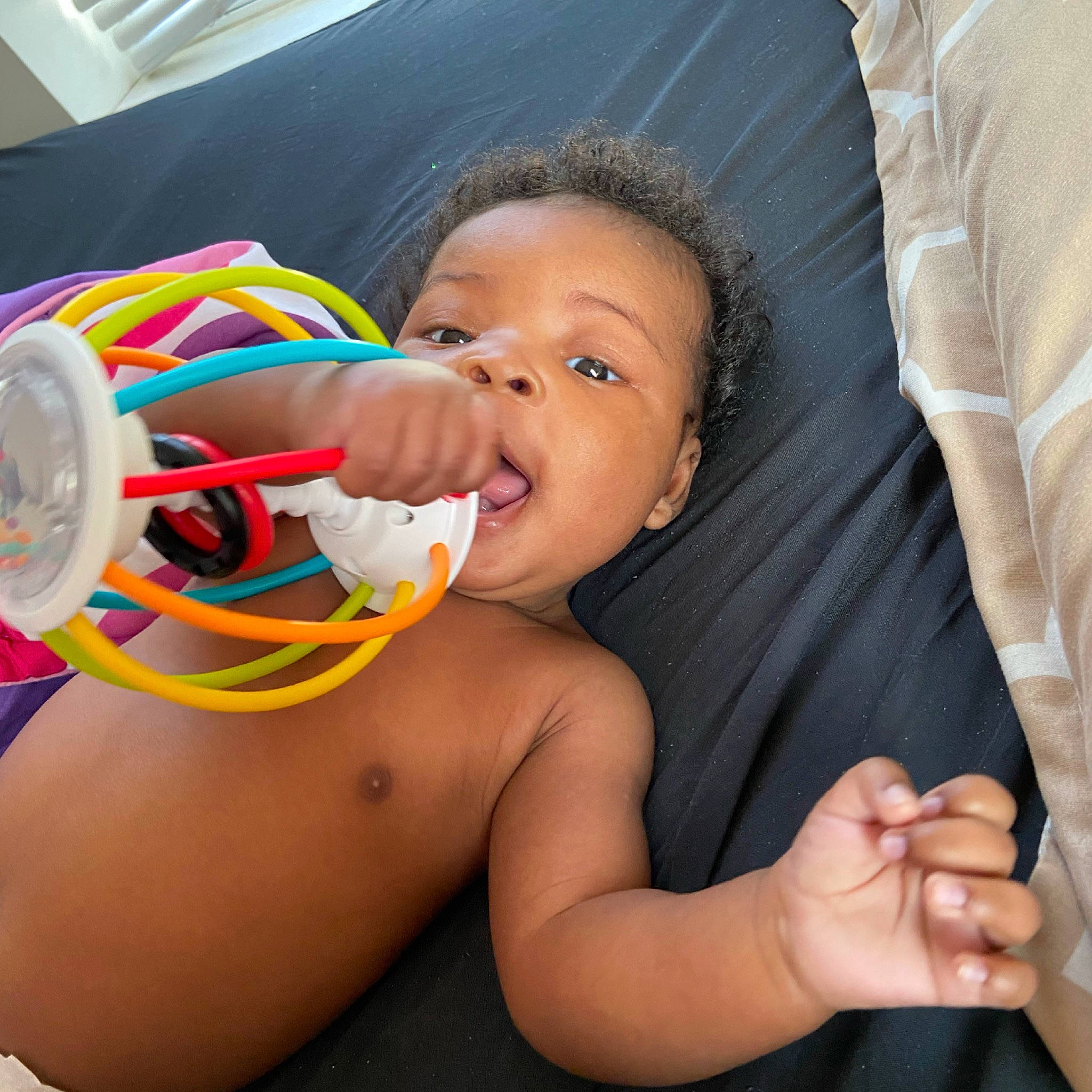 Janiya is registered to the contest to win money with this photo: arm, baby, cheek, child, comfort, drinkware, ear, eyelash, facial_expression, finger, gesture, hand, happy, human_body, mouth, nail, nose, person, skin, sleeve